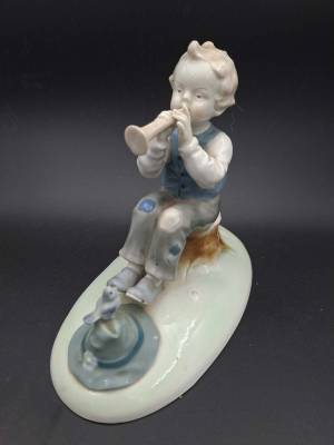 Boy Playing the Flute by Metzler & Ortloff