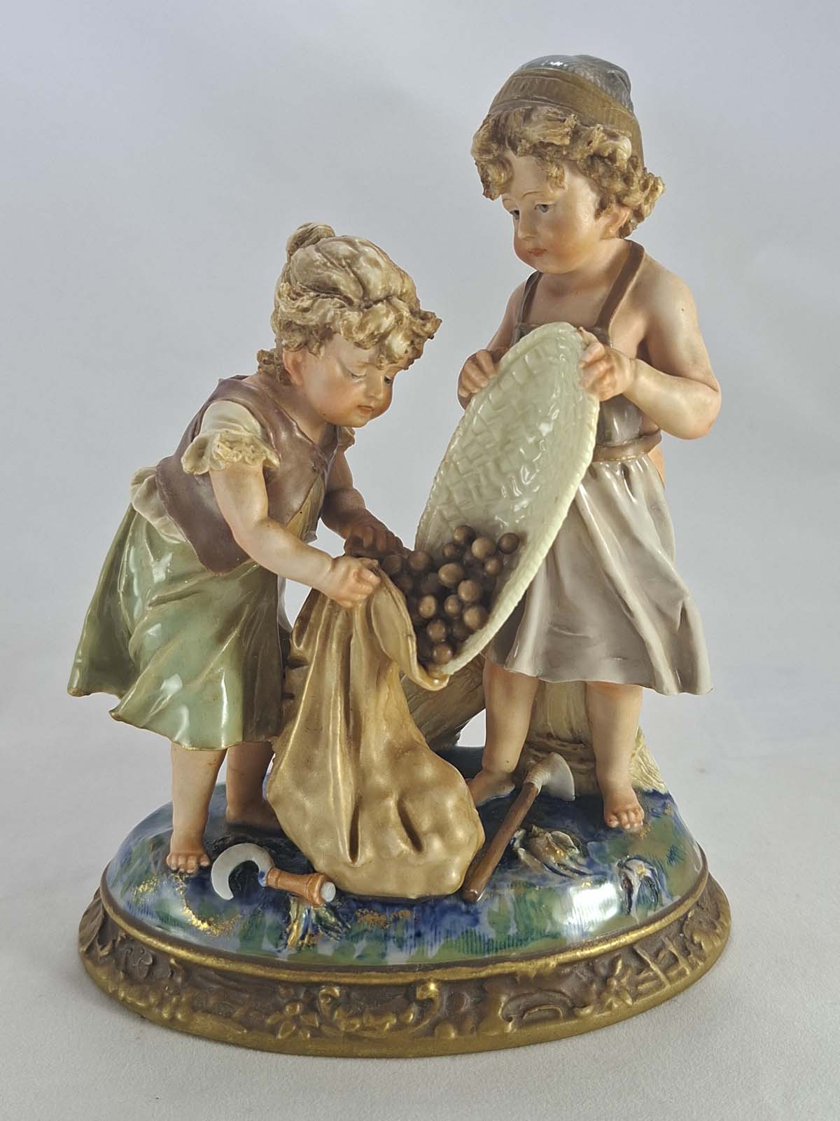 Figurine of Children Gathering Nuts by Ernst Wahliss